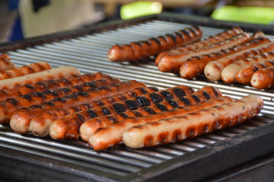 Deliciously grilled sausages on a barbecue, perfect for summer cookouts.
