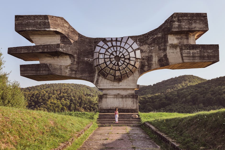 Monument to the Revolution in Podgarić, Croatia, amidst lush greenery.