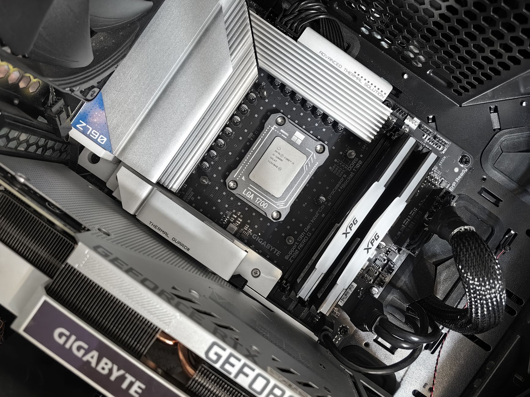 Interior view of a high-performance PC build featuring a Gigabyte motherboard and components. – build check 1440p high