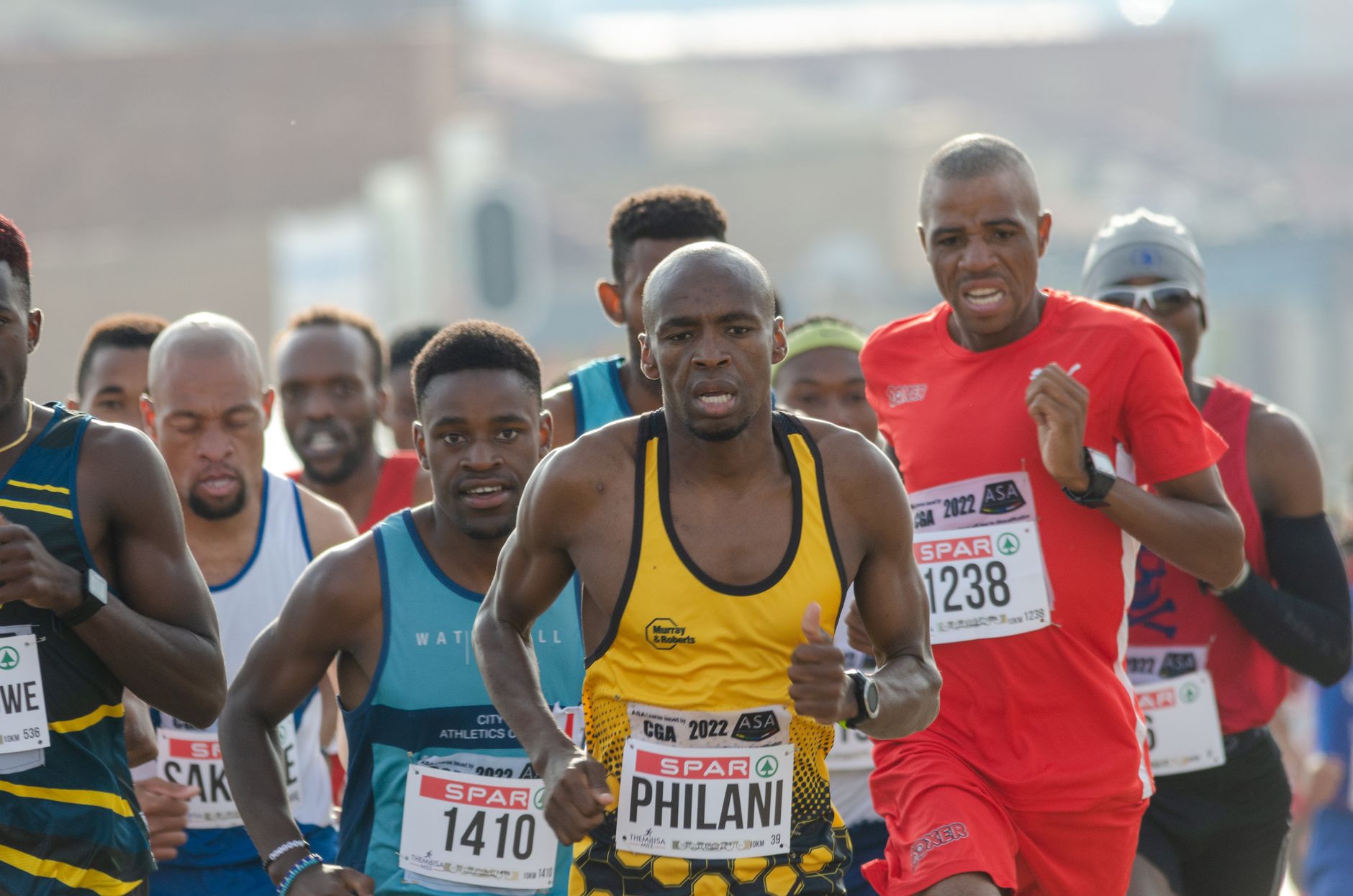 Determined runners participating in a city marathon, showcasing athletic endurance and competitive spirit.